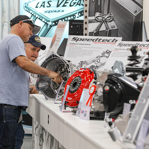 Two men looking at New Product Showcase display
