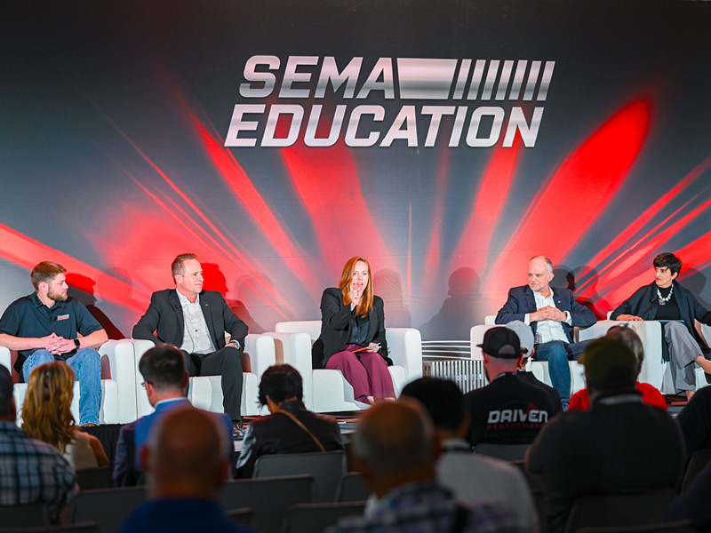 Panelists on stage at a SEMA Show Education session