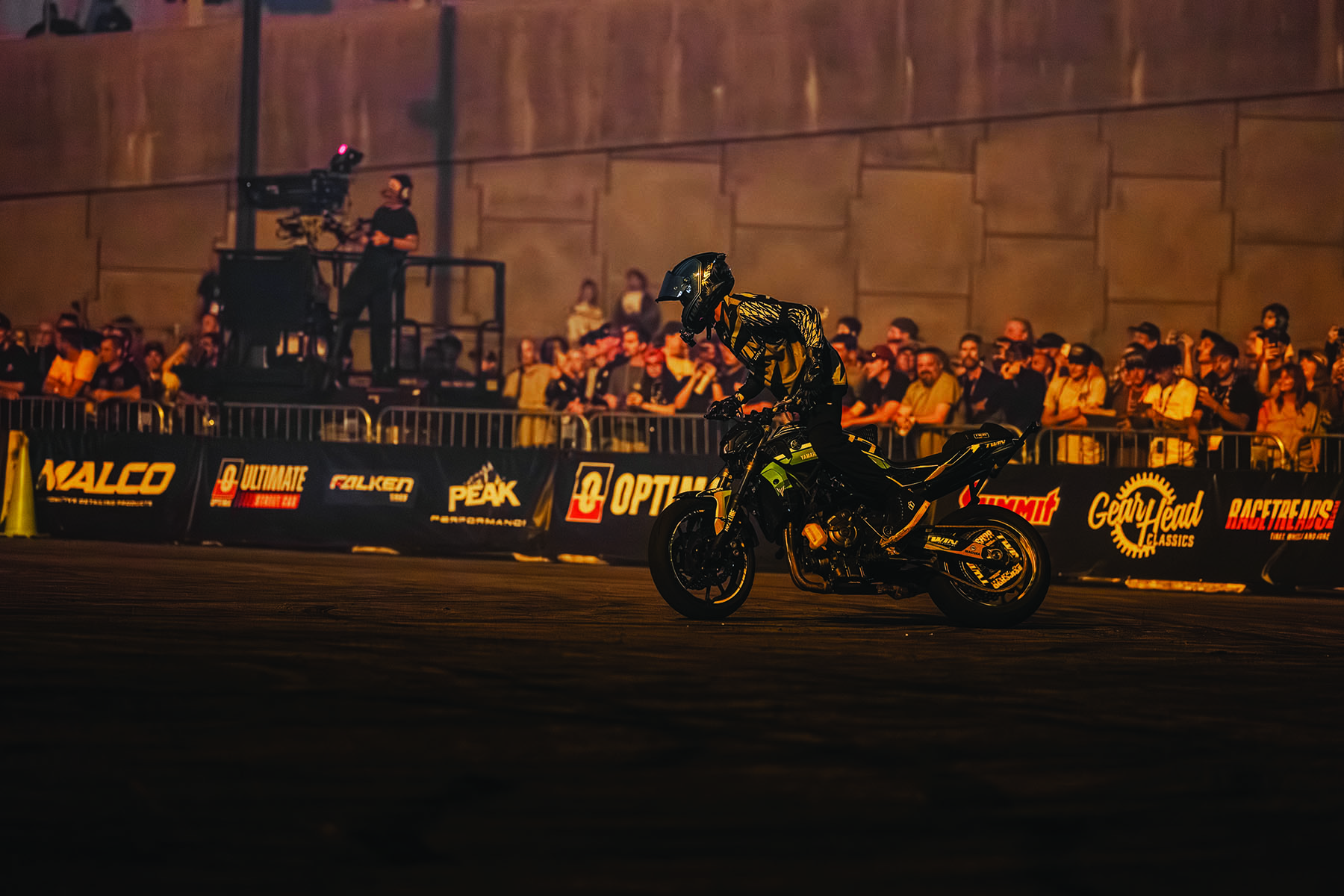 Motorcyclist performing in front of a crowd