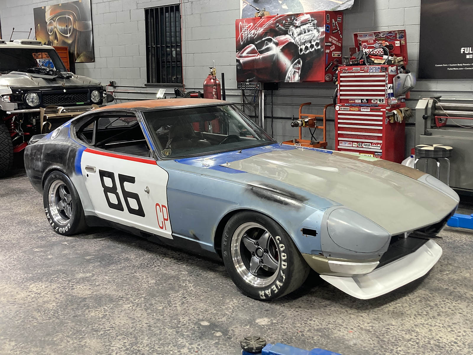'77 Datsun in a shop